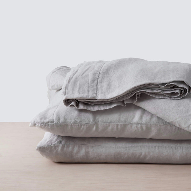stack of grey linen bedding, light-grey