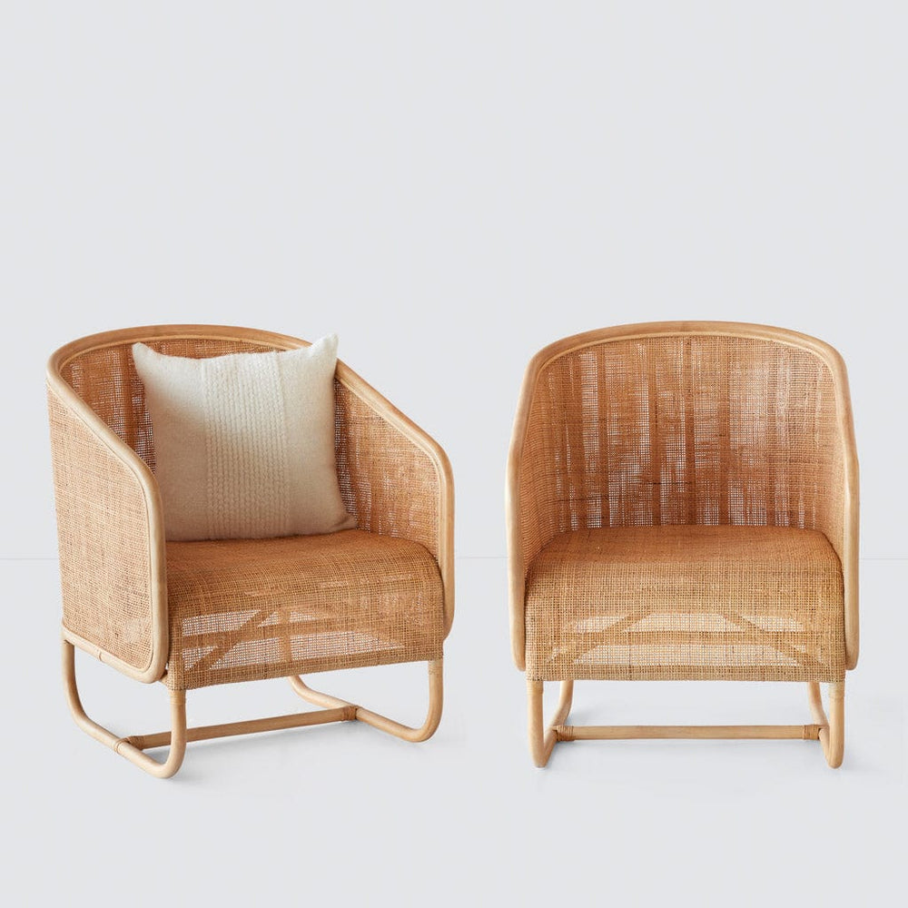 Two cane chairs side by side