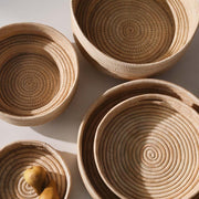 Overhead group shot of woven trays and bowls