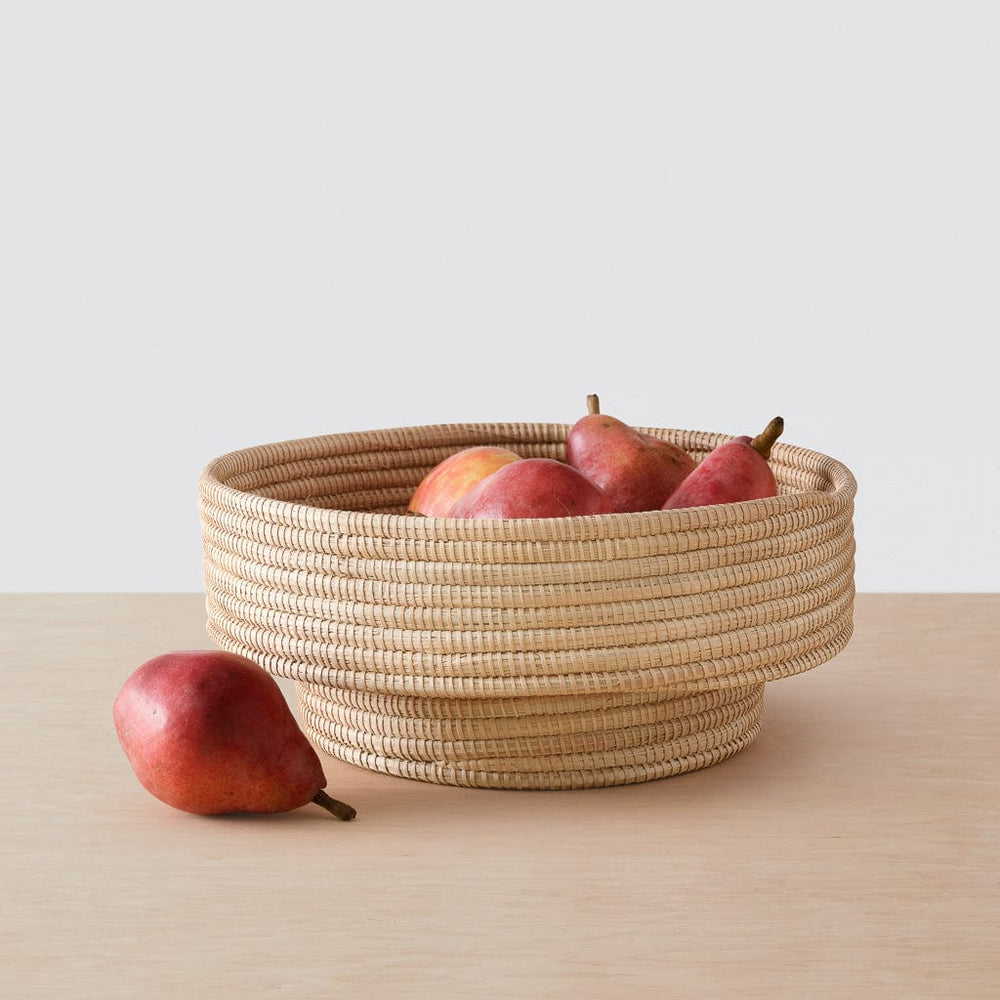 Pears in woven palm bowl