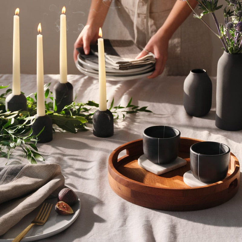 Linen napkins styled on tabletop setting with marble accents, charcoal