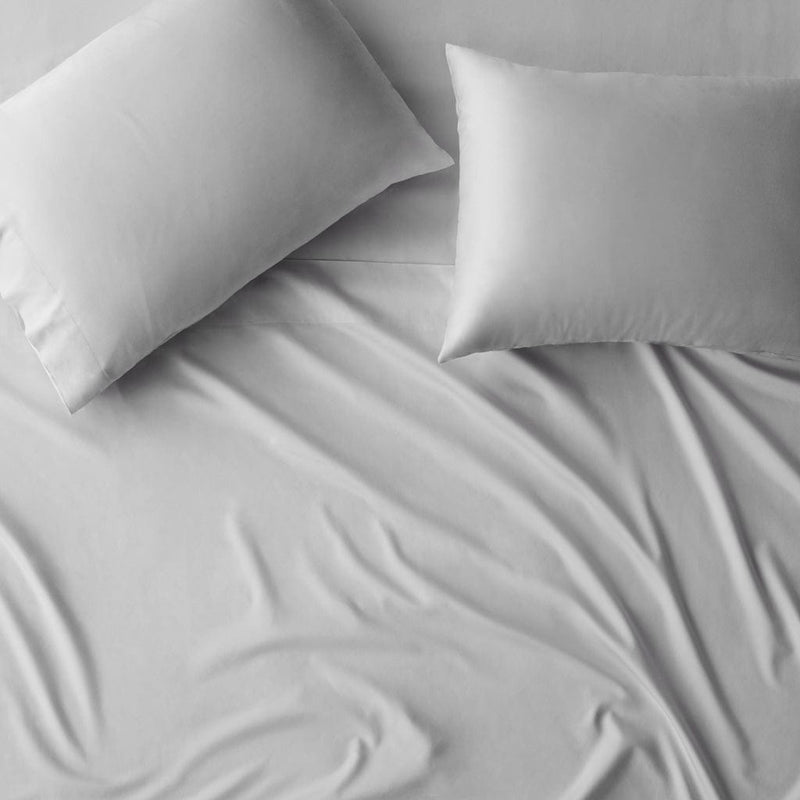Overhead of pillowcases on duvet, solid-light-grey