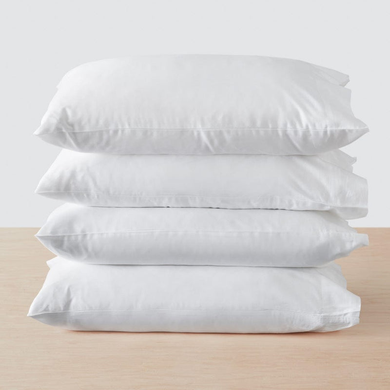 Stack of four pillows, white