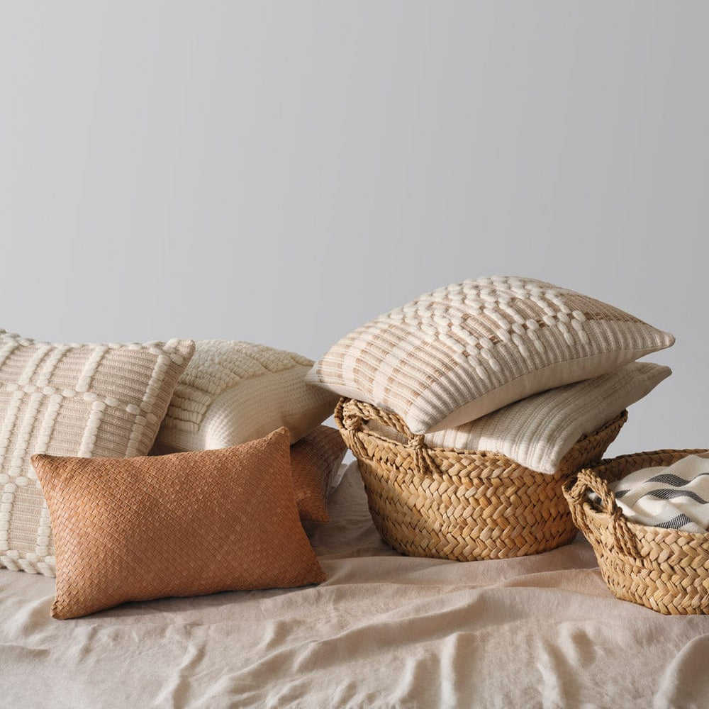 Styled pillow stack with baskets