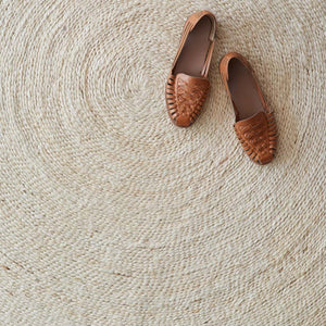 Overhead of Round Jute Rug with Brown Shoes, light
