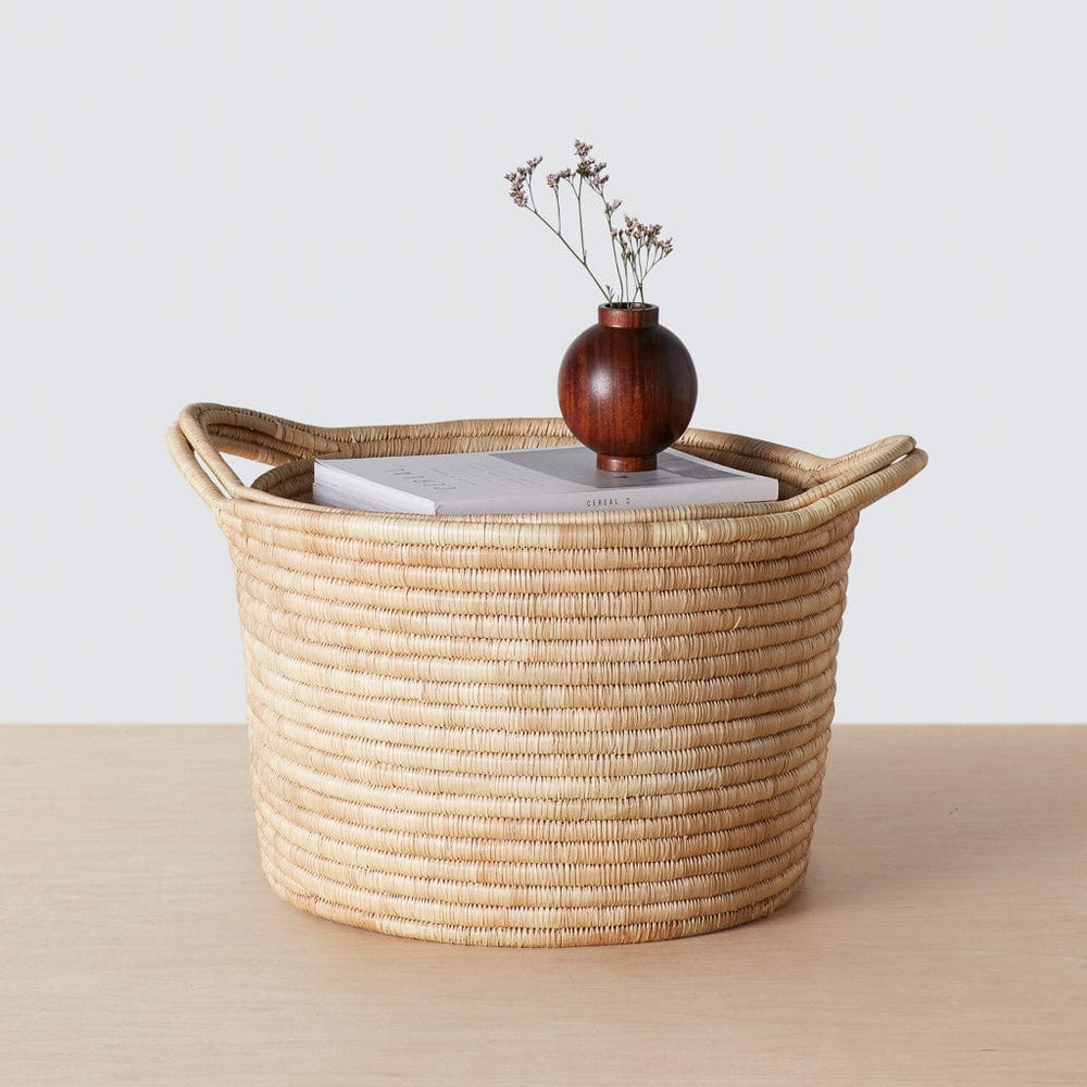 Single woven basket with book and vase