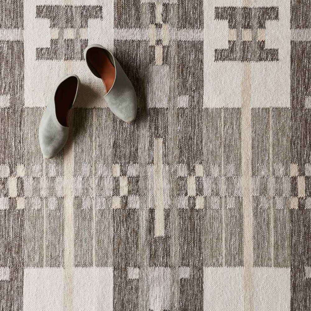 Detailed view of Saira geometric patterned wool rug