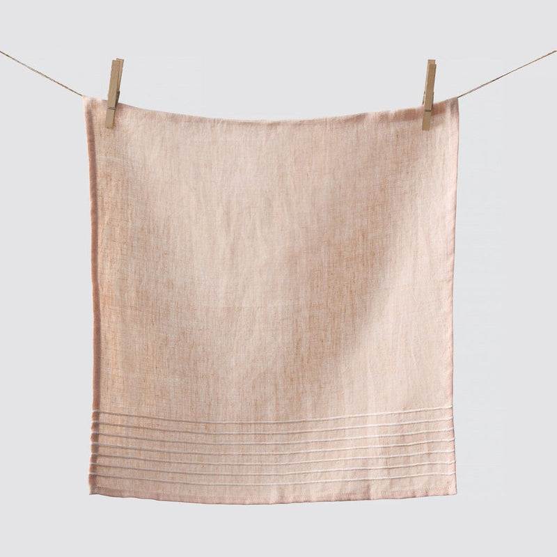 Napkin hanging from clothespins, rose