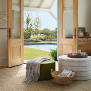 Ottomans styled by French doors, stripe