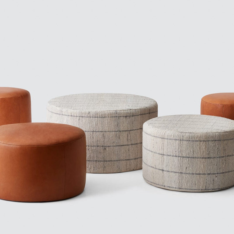 Collection of cotton and leather ottomans, stripe