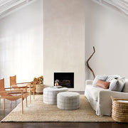 Large and small ottoman in living room, stripe