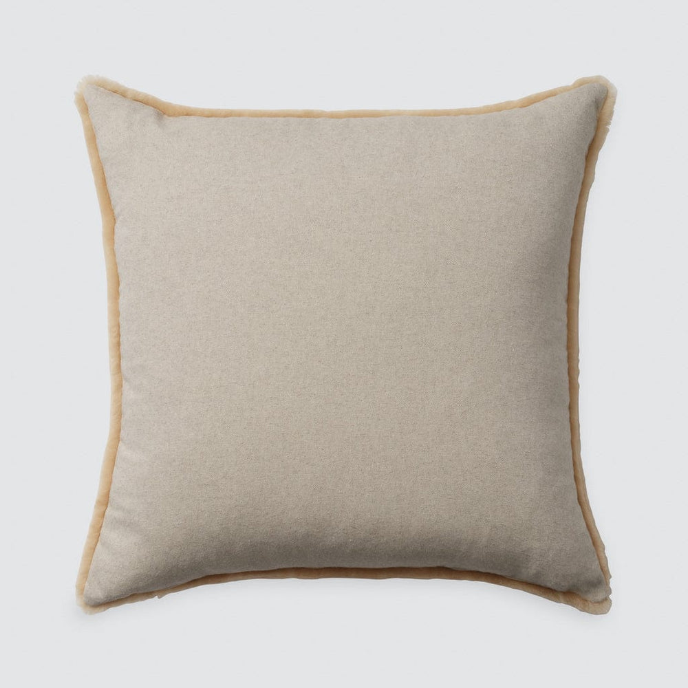 Light ecru cotton backing on tan sheepskin accent pillow