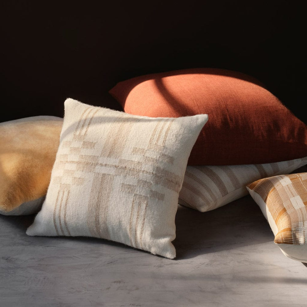 Stack of accent pillows in neutral fall tones
