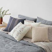 boucle pillow styled in living room, sand