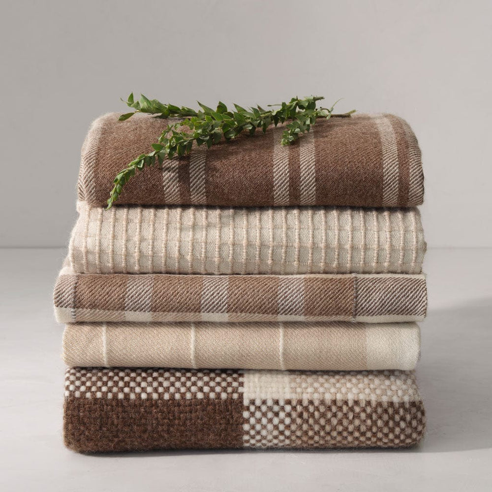 Styled throw stack with greenery