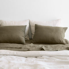 Close Up of Bed Made with Olive and Tan Linen Bed Set