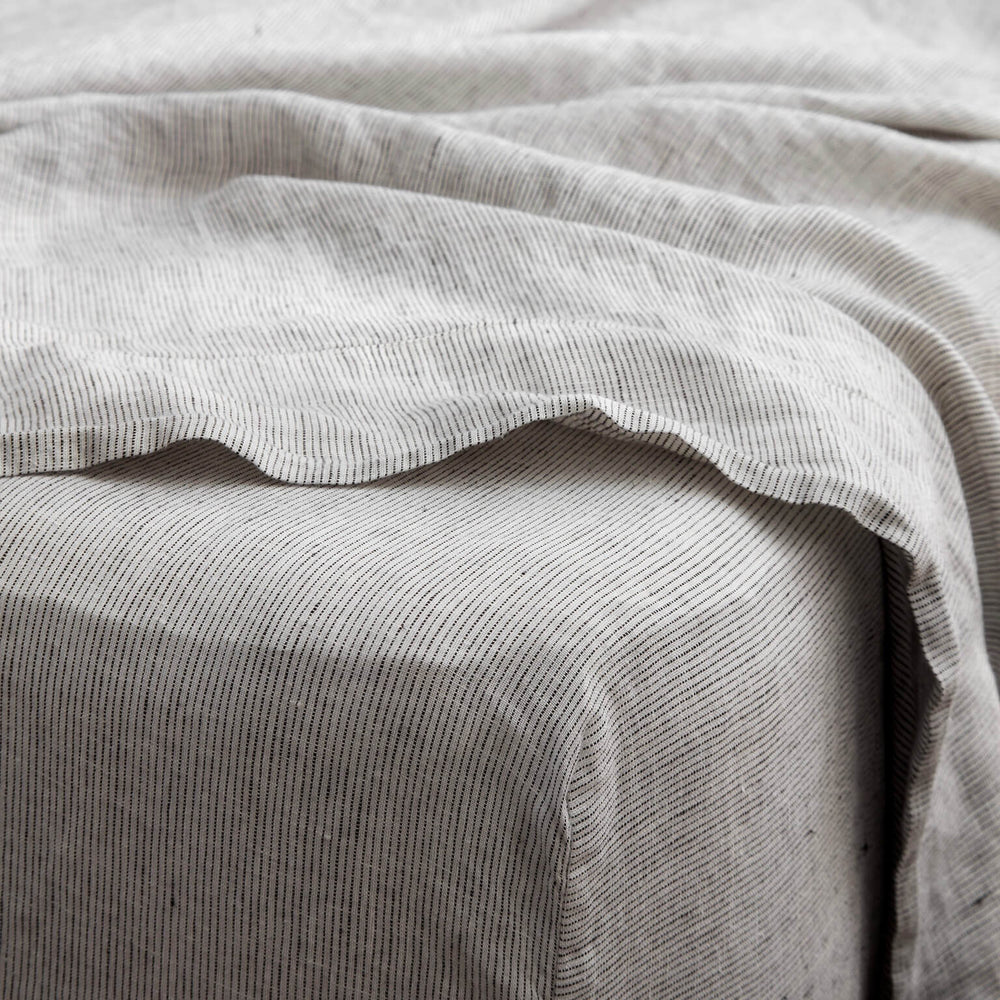 Detail of grey stripe fitted sheet