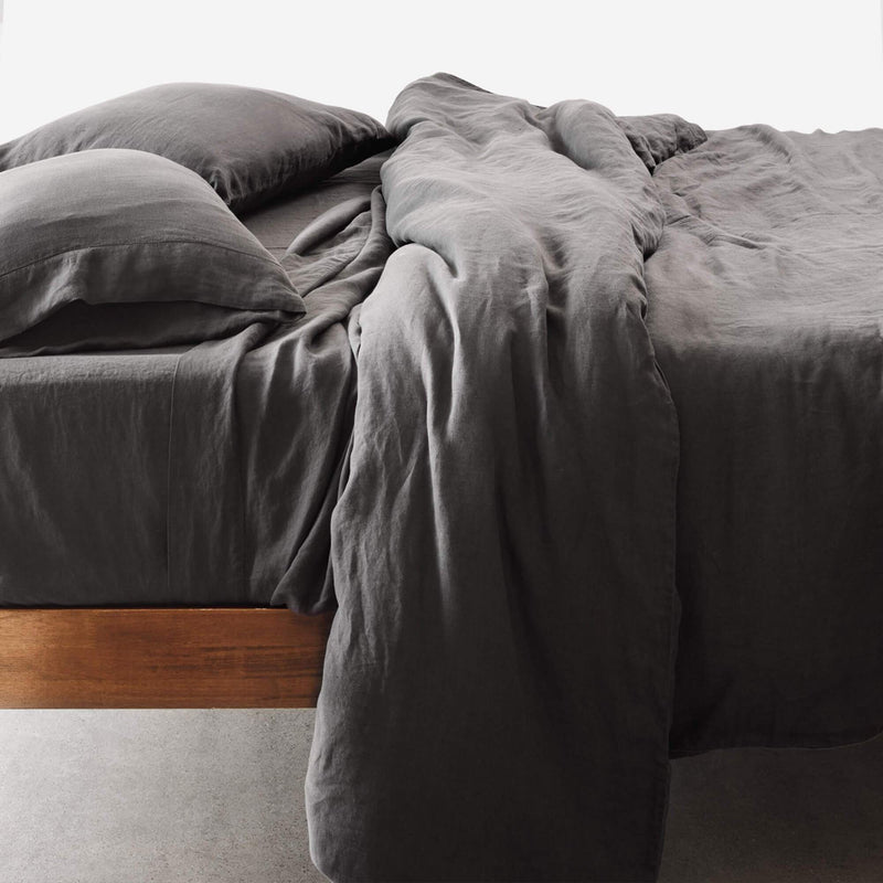 Side View of Bed With Charcoal Linen Bedding, charcoal
