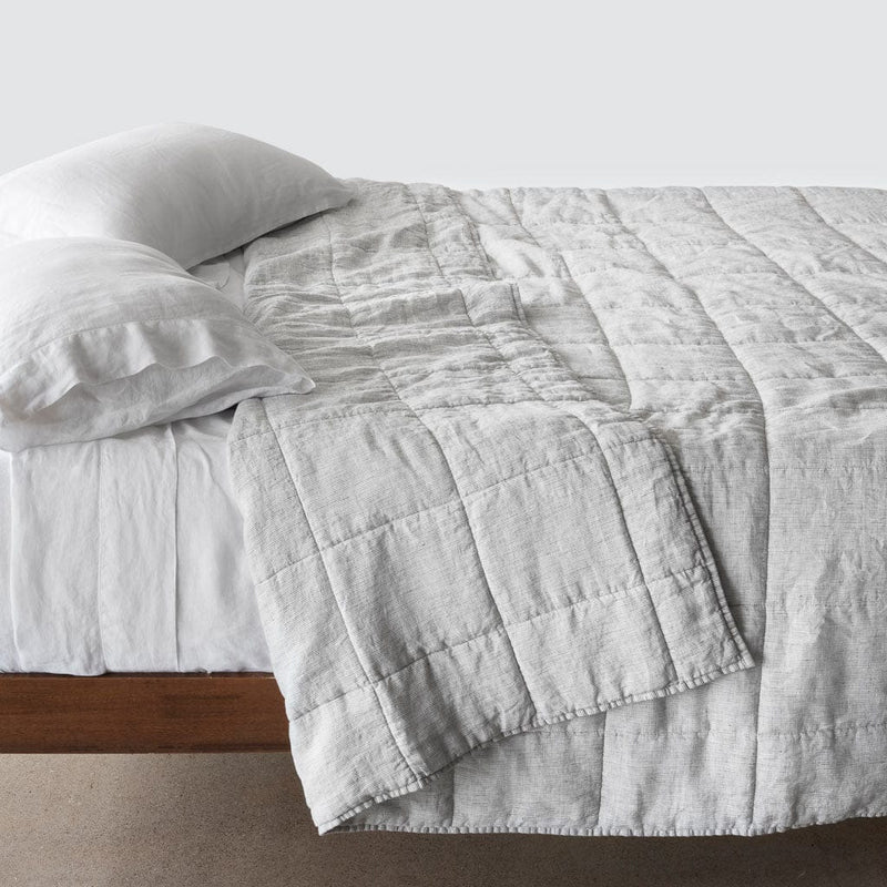 Side of bed with graphite thin stripe stonewashed linen quilt, graphite-thin-stripe