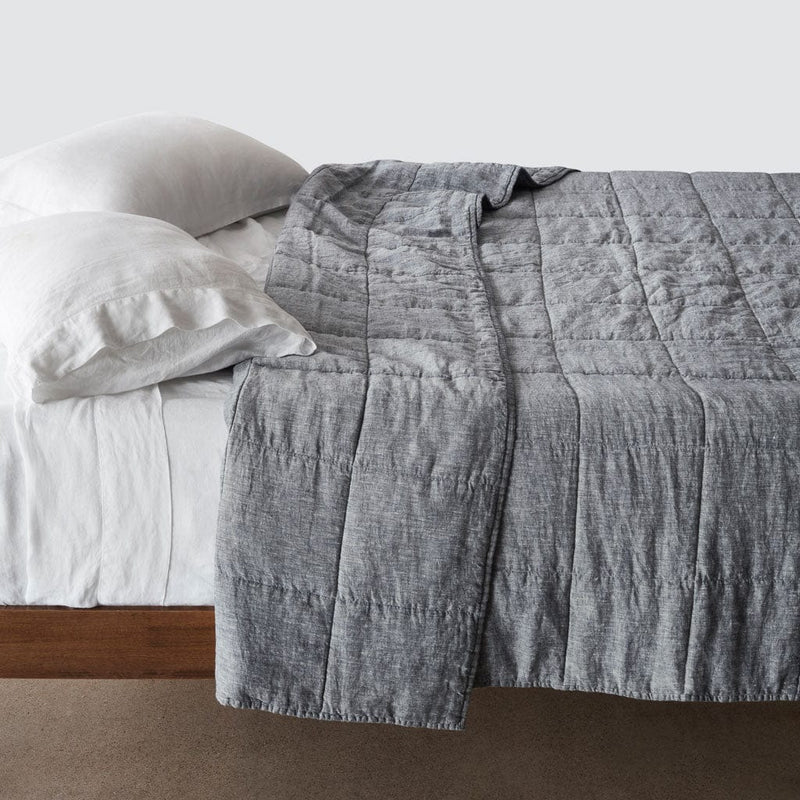 Side of bed with indigo chambray stonewashed linen quilt, indigo-chambray