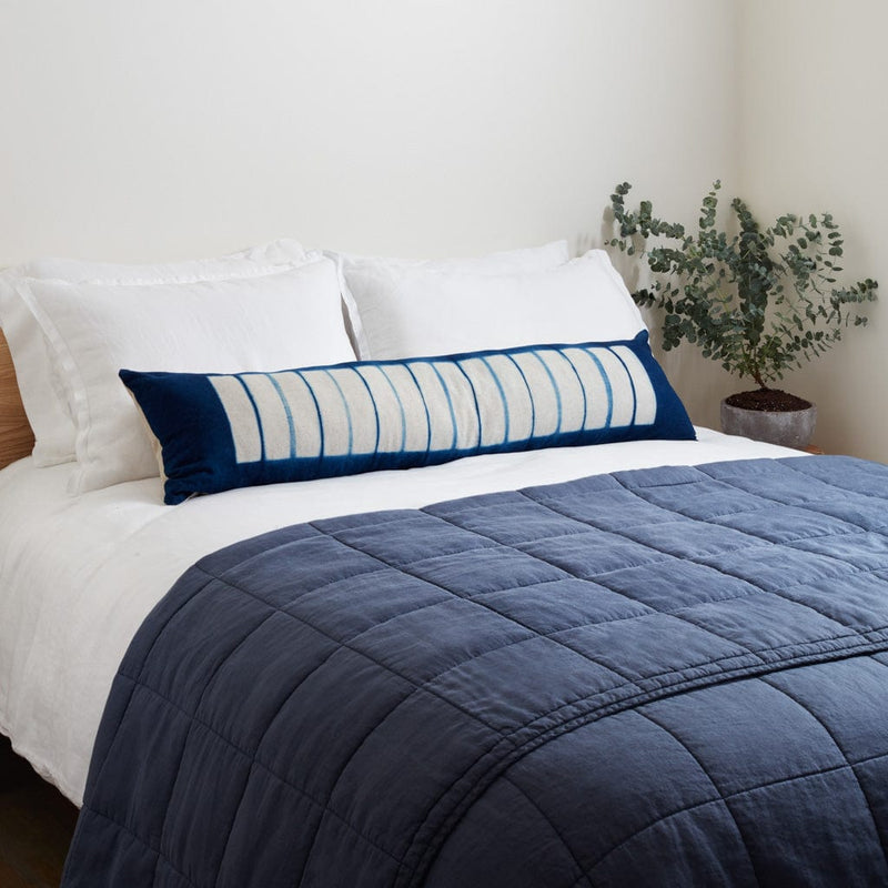 Styled bed with indigo dyed lumbar and slate blue linen quilt, slate-blue
