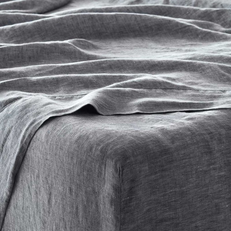 Detail of indigo chambray fitted sheet, indigo-chambray
