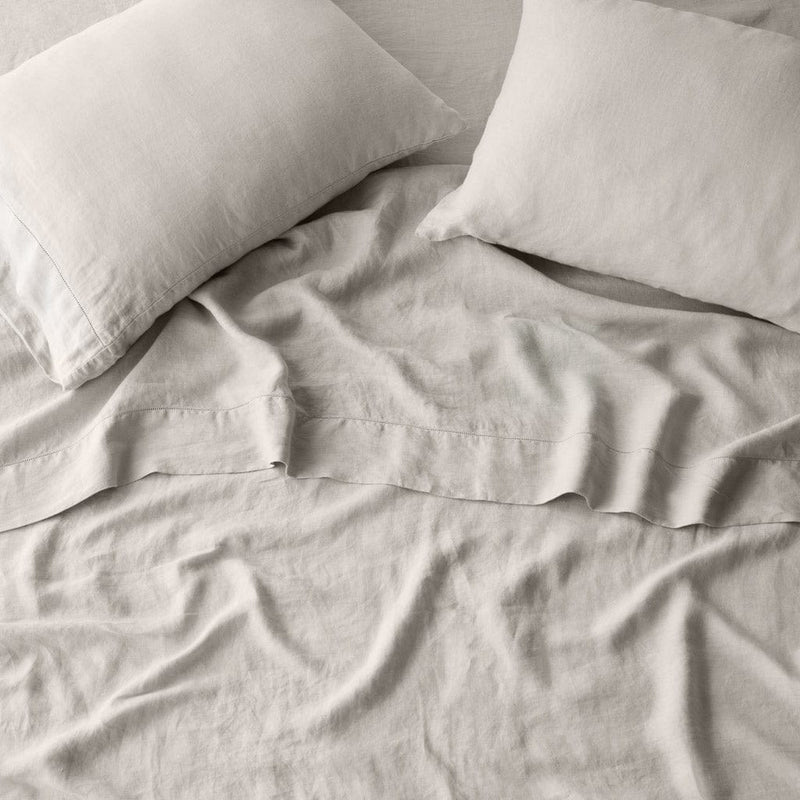 Overhead of sand sheet set and pillows, solid-sand