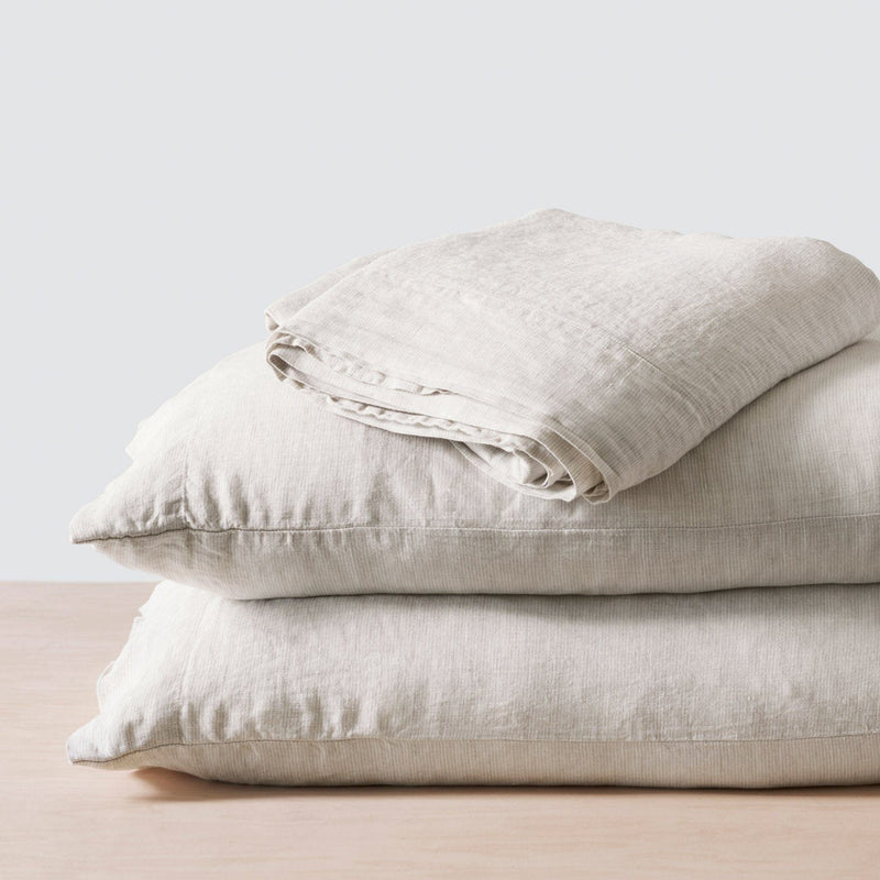 Folded Stack of Beige Pinstripe Linen Sheets and Pillowcases, sand-thin-stripe