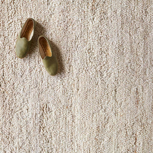 Detailed view of Suhana textured wool rug in multiple sizes, ecru
