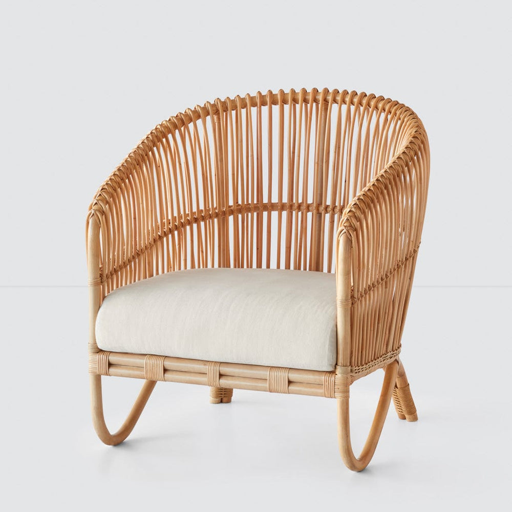 Rattan lounge chair with linen cushion