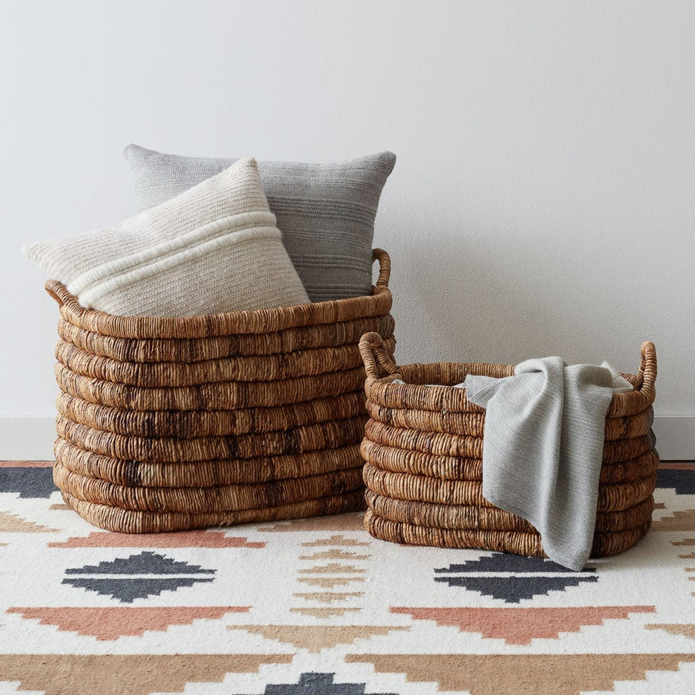 Modern Area Rug with Handwoven Baskets and Pillows, sunset
