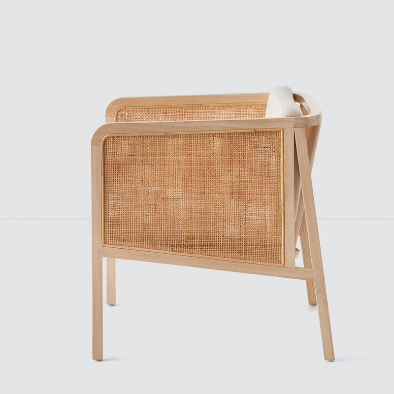 Side of wood and cane chair, linen-cushion