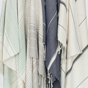 Set of towels hanging, stone-grey