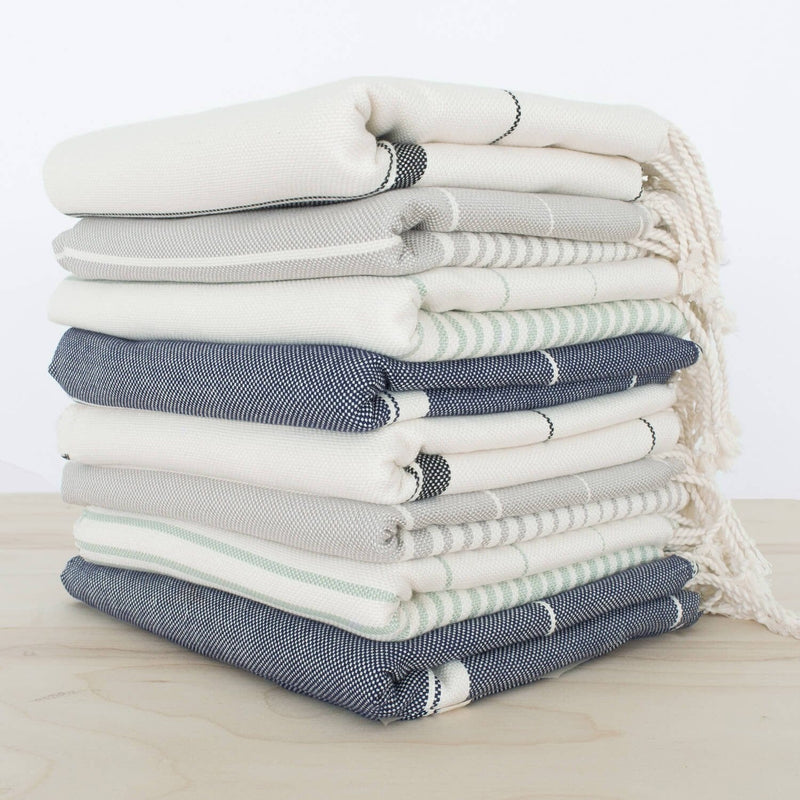Stack of woven towels, stone-grey