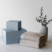 gift boxes styled with throws and vase