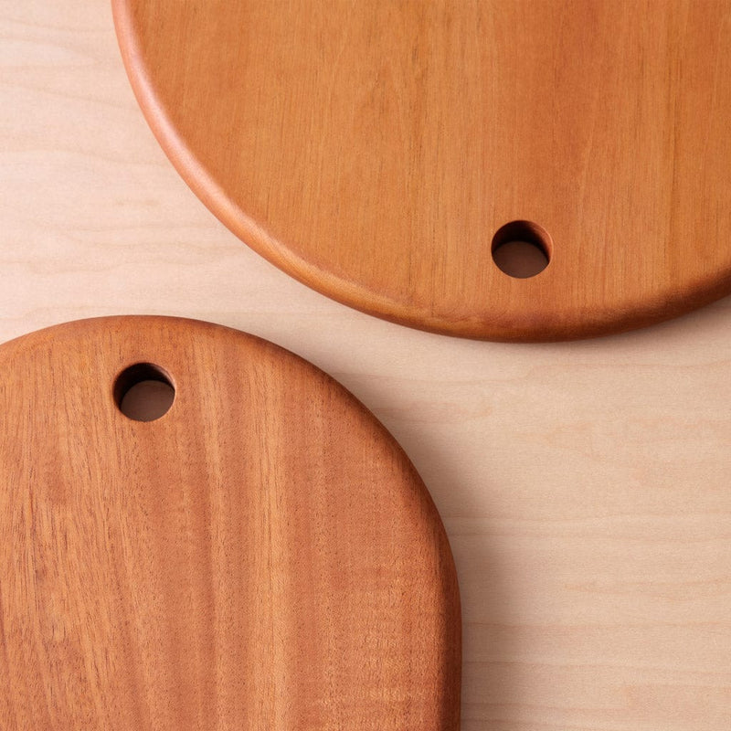 Top edge of two mahogany wood serving boards, mahogany