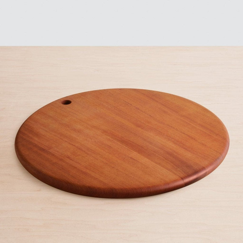 Single mahogany charcuterie board lying on counter, mahogany