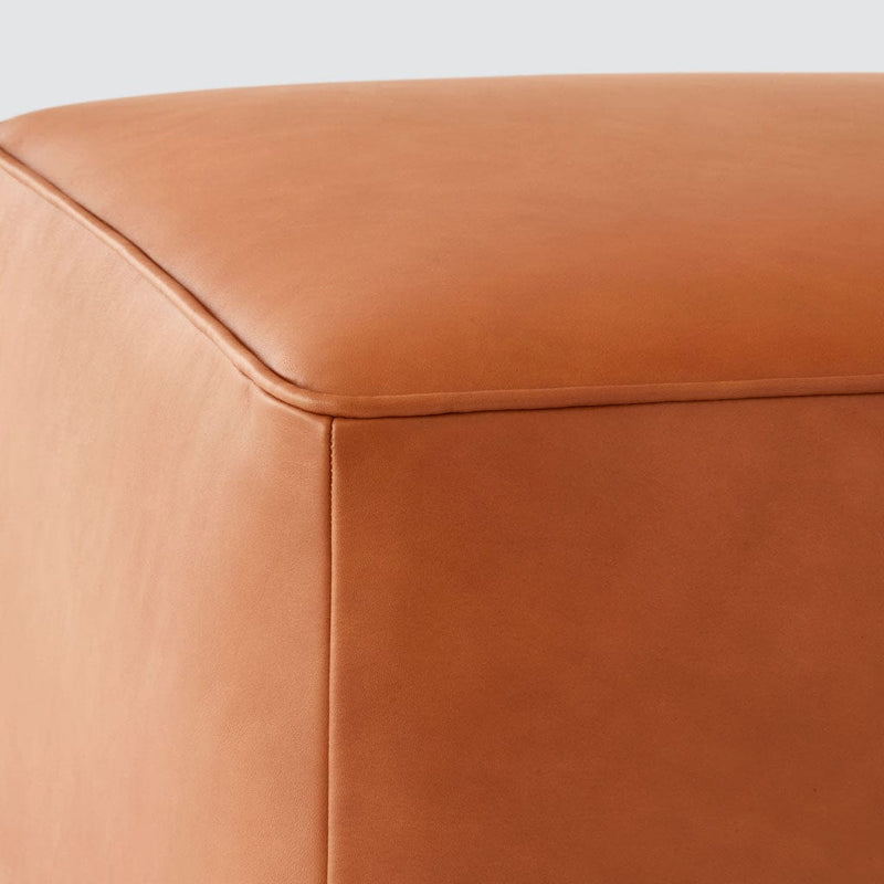 Detail of leather ottoman stitching , caramel