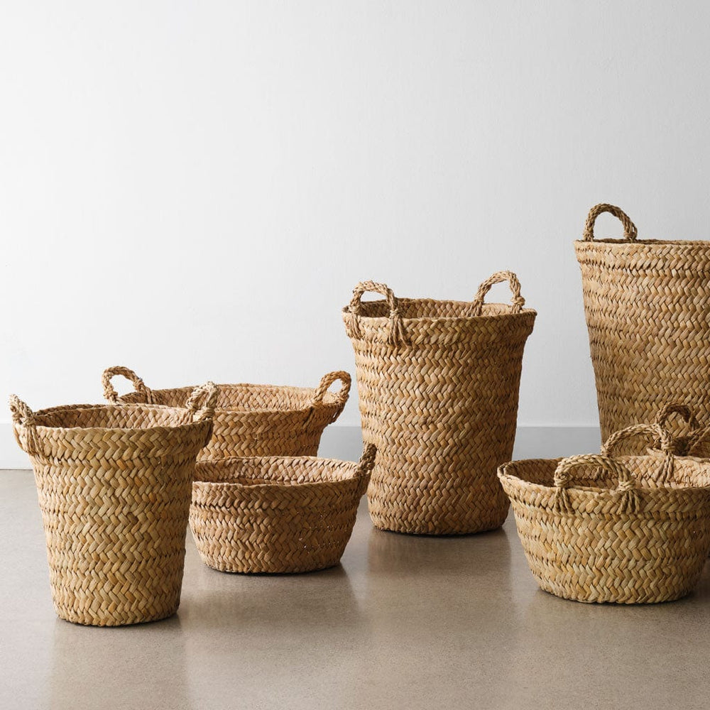 Collection of multiple woven floor and storage baskets