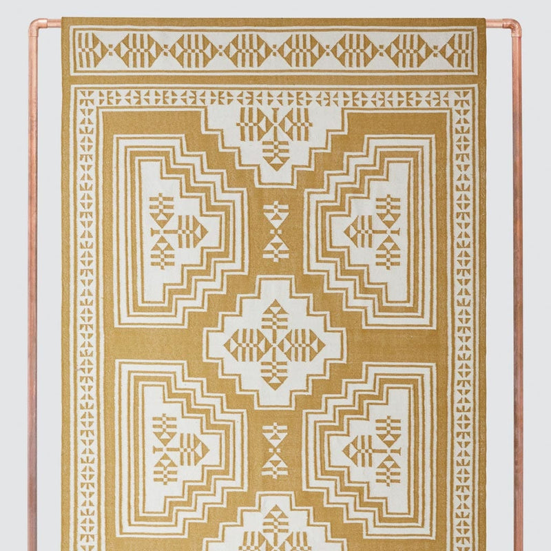 Patterned area rug, mustard