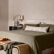 block print pillow styled on bed