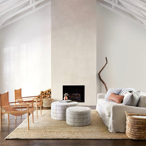 Large Thick Jute Rug with Leather Chairs and Stools in Living Room