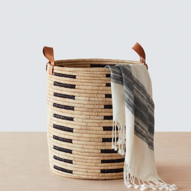 Modern woven basket with leather handles, black-natural