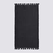 Black bath mat with tassels, black